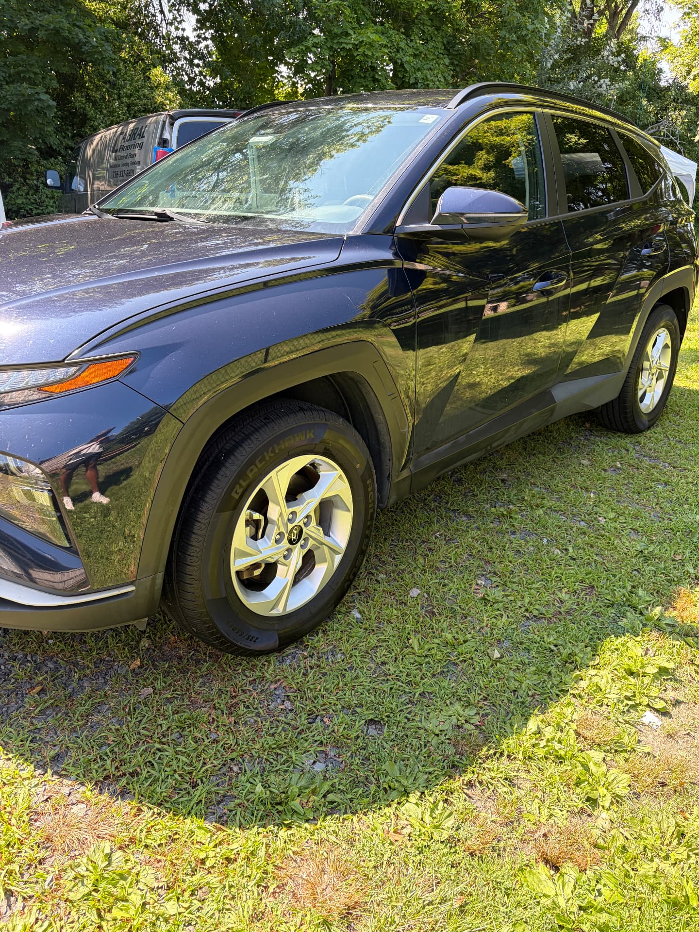 Navy Hyundai Tucson exterior detail with tire shine